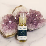 Abundance and anxiety support aromatherapy blend 5 ml bottle topped with an amethyst roller ball
