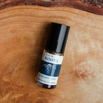 Grounding strength aromatherapy blend on raw wood