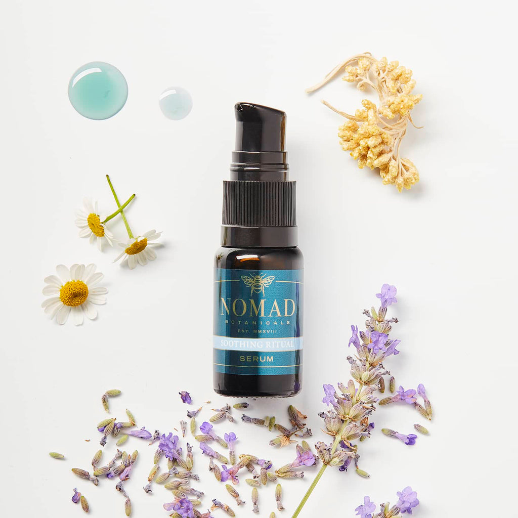 Picture of Soothing Ritual Serum with fresh lavender buds, chamomile, helichrysum, and blue oil droplets